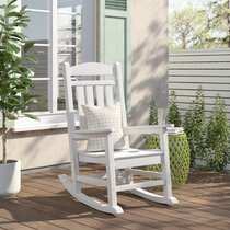 White plastic outdoor store rocking chairs